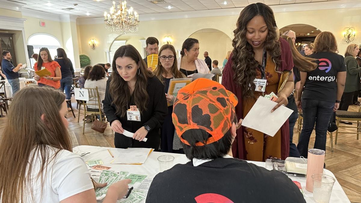 people talking at an event table