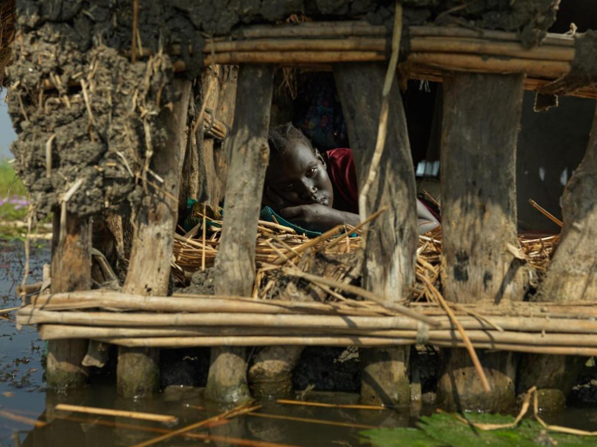 Nya Jol living precariously close to the flood line. It has been five years since the floods wrecked havoc on her community. "My husband goes to market often to find work, while I remain here to look after the children. I hope he finds some casual work soon so we can buy vegetables to eat with the fish we catch" says Nya.