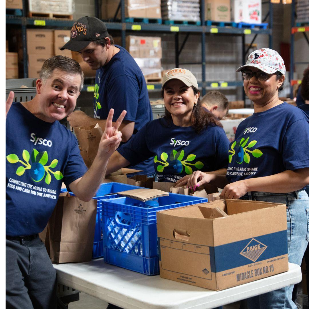 people standing with food crates