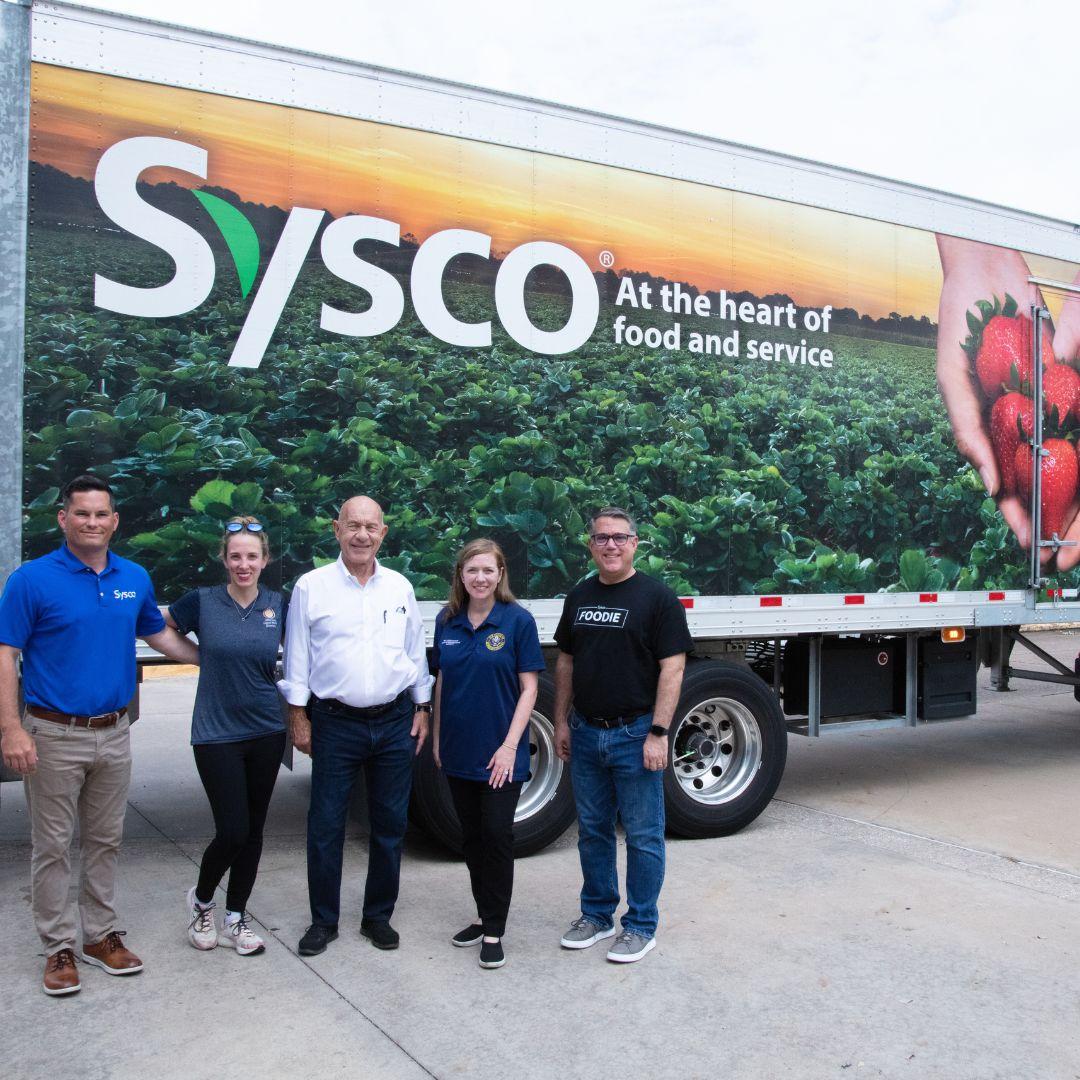 group photo in front of Sysco truck