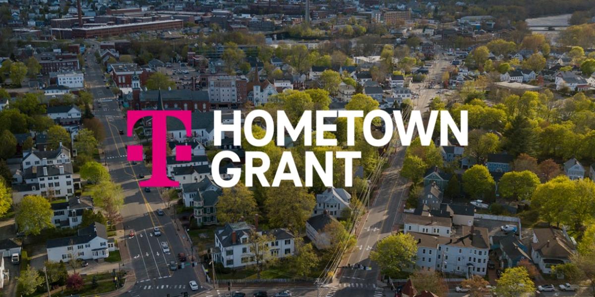 Aerial view of a residential area, Tmobile logo and "Hometown Grant" on the foreground.