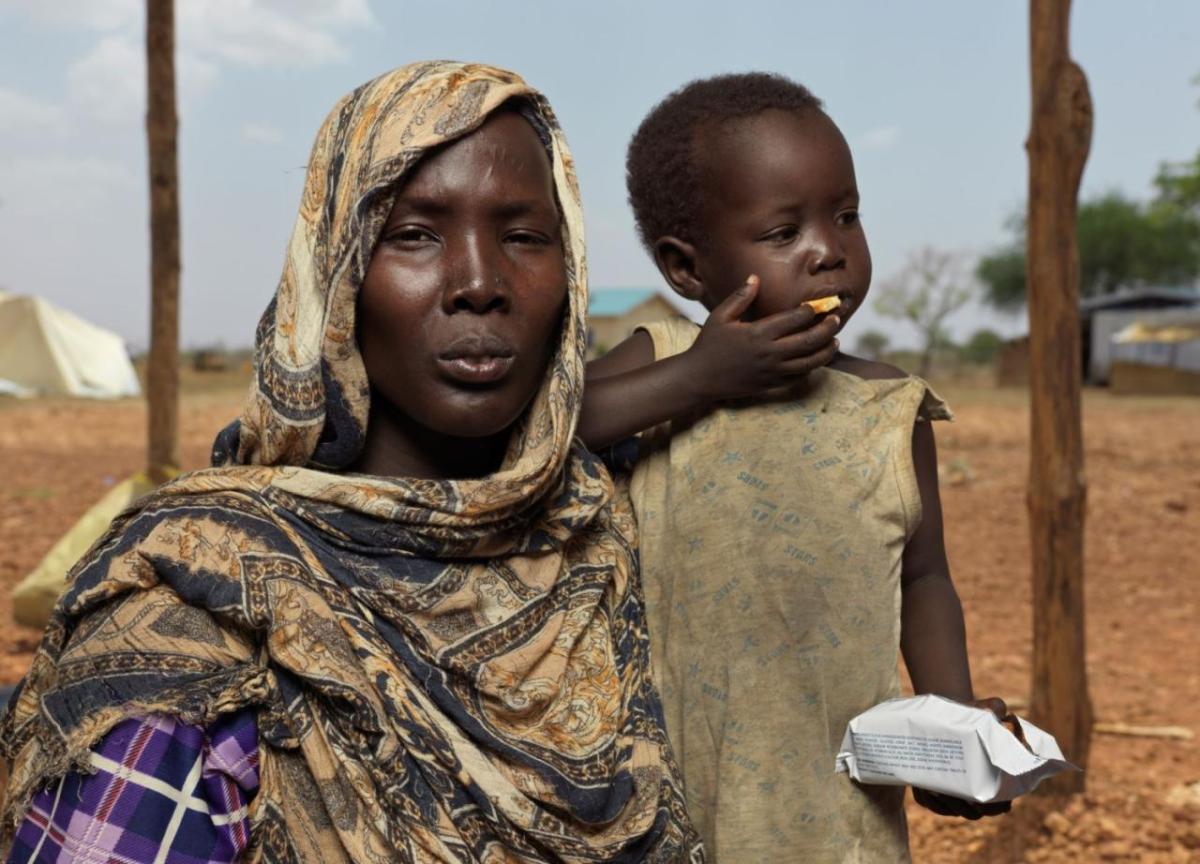 Nyibol Mathiang Deng, 27, is six months pregnant and arrived at the border with her youngest daughter. 