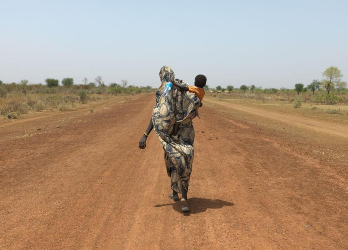 Mothers like Nyibol Mathiang Deng are forced to trek miles to reach safety.