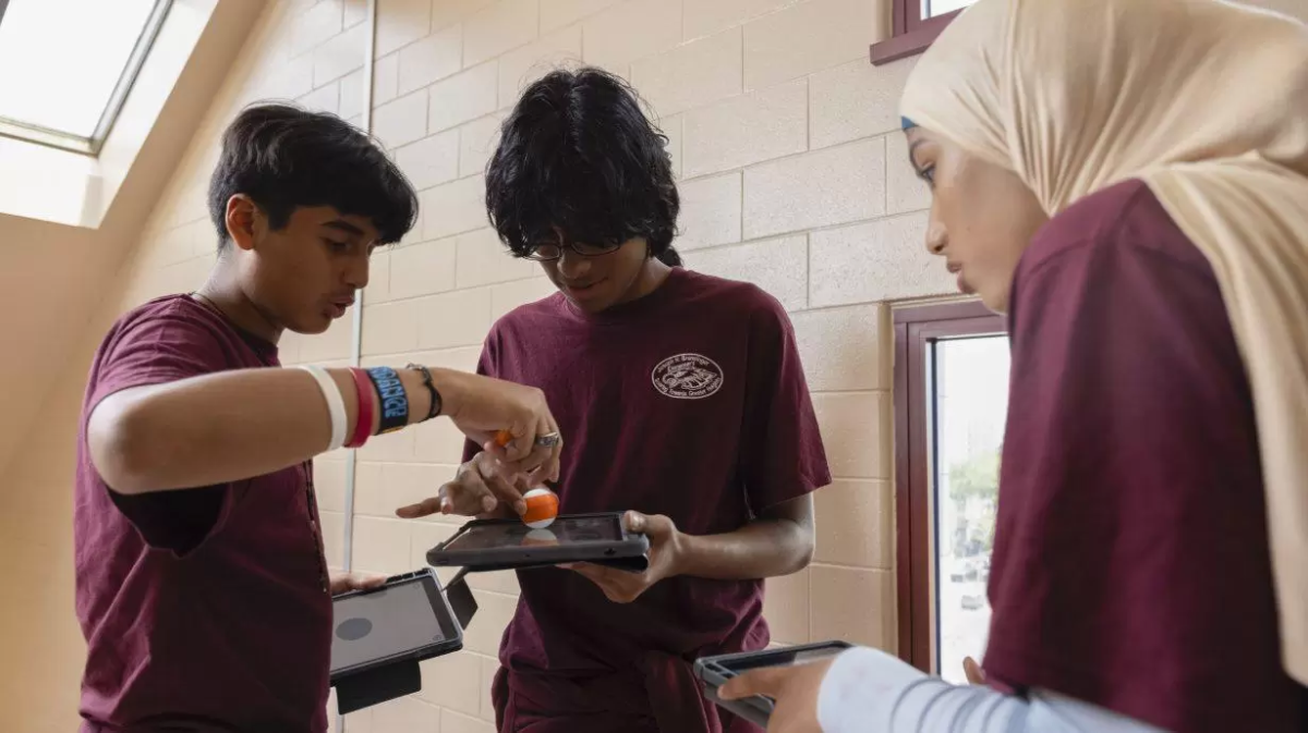 Students working together on tablets