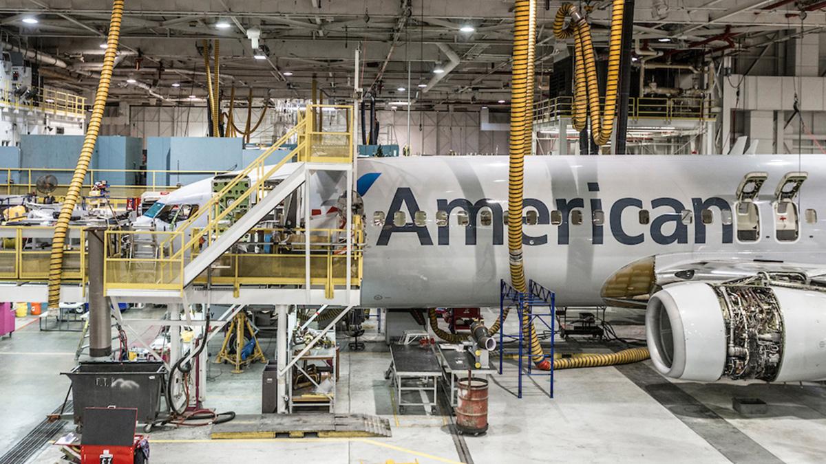 An American airplane being worked on in a hanger.