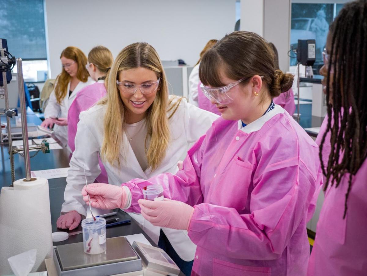 People in a lab making lipgloss