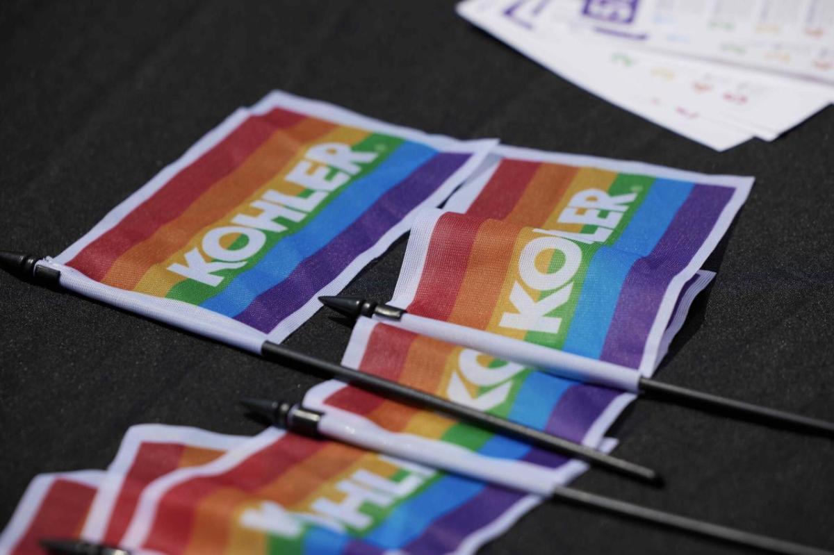 Close up of small rainbow flags with "Kohler".