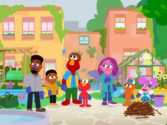 A scene of cartoon Sesame Street characters in a neighborhood