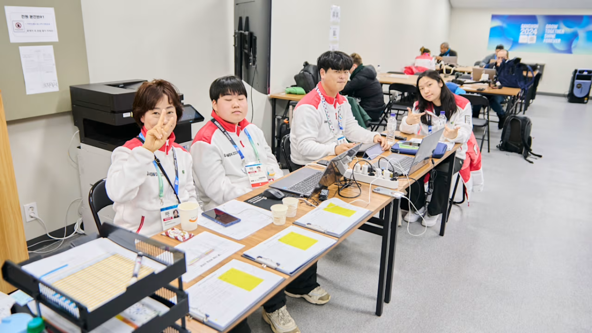 4 people at a desk