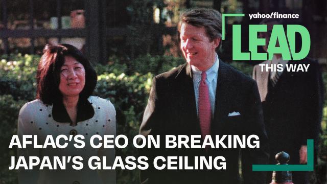 Text: "Aflac's CEO on breaking Japan's Glass Ceiling". Two people walking and talking together outside