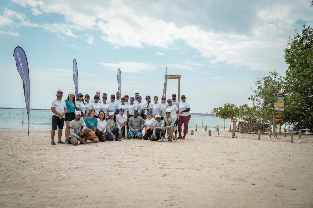 A group posed on a beach