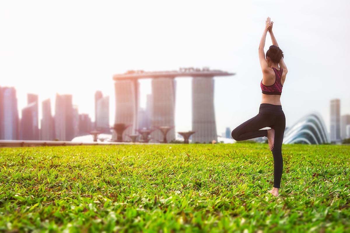 A person practicing yoga in the park