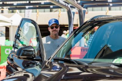 National Drive Electric Week/Plug In America Dave Collette test drives an EV at National Drive Electric Week.