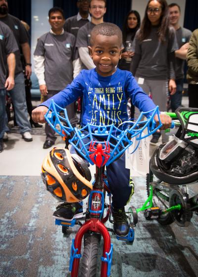 Children of active duty servicemembers visited the firm's New York City office to pick up the bicycles that our associates just made for them