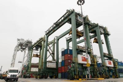 SCE will help convert nine of these green rubber tire gantry cranes to electricity at the Port of Long Beach. Credit: Elisa Ferrari