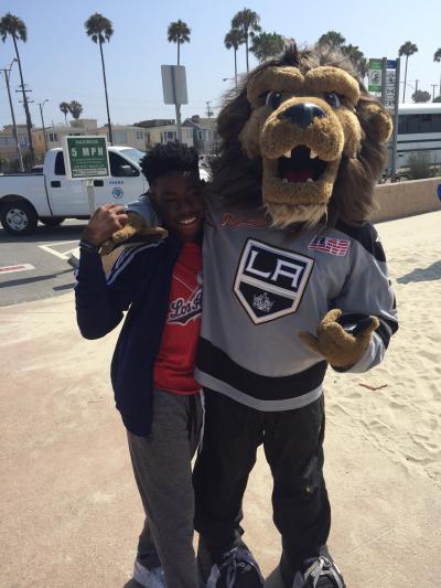 AEG’s LA Kings mascot, Bailey, greets kids as they arrive for the Long Beach All-City Beach Day on August 11, 2017.