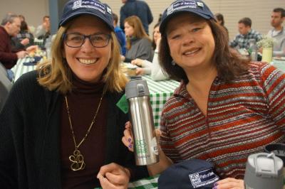 Employees show off their 40’s Club hats, pins, water bottles, and hang tags at Timberland’s annual 40’s Club breakfast to celebrate Timberland’s volunteer champions. The 40’s Club members served all of their 40 available service hours in 2017.