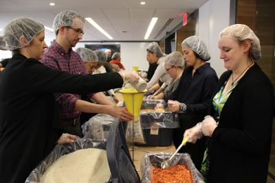 Viacom employees prepping some of the thousands of meals they assembled in conjunction with Rise Against Hunger during Viacommunity’s 2017 Season of Giving.