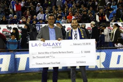 LA Galaxy Technical Director Jovan Kirovski presents a check to United Way Santa Barbara in support of the Thomas Fire & Flood Fund.
