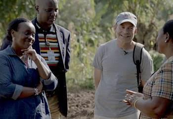 Dr. Diane Gashumba, Rwanda Minister of Health (far left), and Fisk Johnson, Chairman and CEO of SC Johnson (center right), discuss the benefits of SC Johnson-sponsored health posts in Rwanda. The additional health posts SC Johnson is supporting will expand access to health care and malaria education for more than 200,000 people.