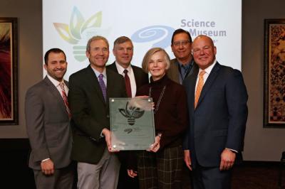The Science Museum of Minnesota received the Energy Efficiency Leader Award from Trane today for the museums long-term commitment to providing a learning atmosphere with minimal impact on the environment. Shown here (from left) are Matt Spresser, account manager for Trane, Patrick Hamilton, director of global change initiatives at the Science Museum of Minnesota, Mark Platt, sales manager at Trane, Alison Brown, president and CEO of the Science Museum of Minnesota, Todd Gray, facility director of the Science Museum of Minnesota, and Mitchell Farrell, vice president at Trane.