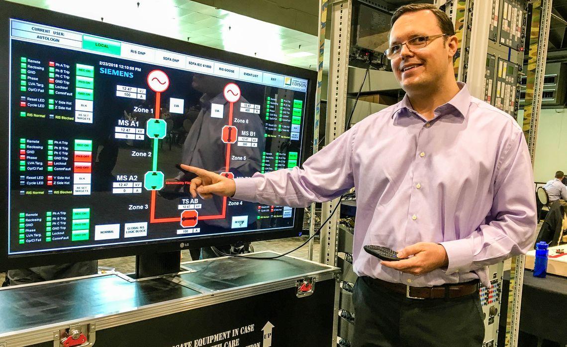 SCE engineer Christopher Huff shows a typical circuit and how a remote integrated switch can help identify a problem and isolate it. Credit: Mary Ann Milbourn