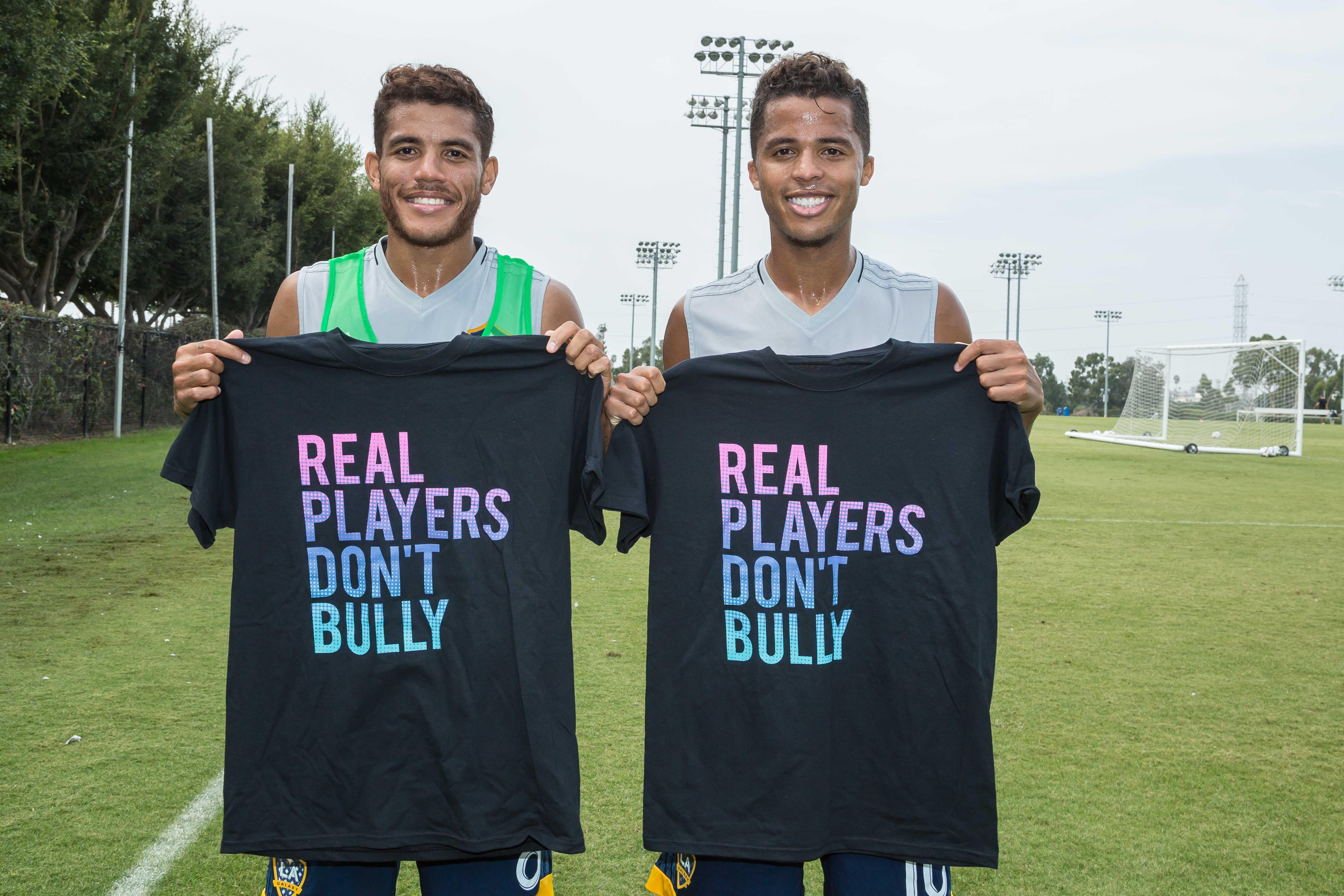 LA Galaxy players Giovani dos Santos and Jonathan dos Santos participate in the Playworks campaign, Real Players Don’t Bully, by sporting shirts with the campaign slogan to raise awareness about National Bullying Prevention Month.