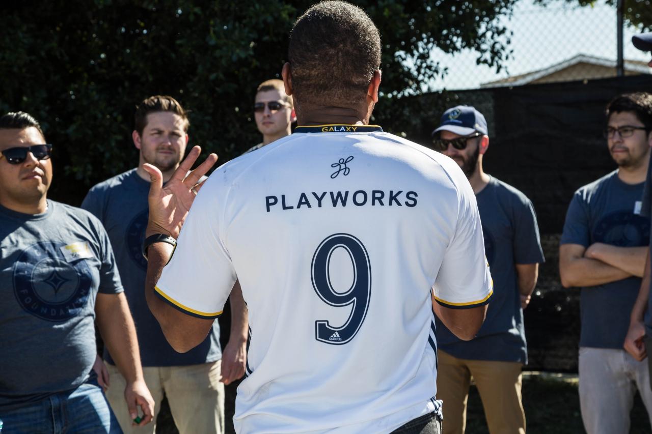 Playworks Southern California staff greet LA Galaxy staff before getting to work beautifying Community Preparatory Academy in Carson, Calif. on February 7, 2018.