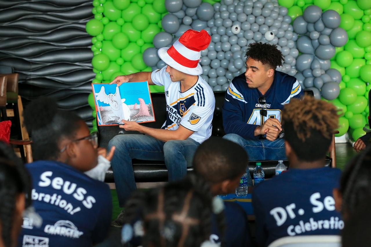 LA Galaxy’s Tomas Hilliard-Arce and LA Chargers’ James Onwualu read to students during the annual Read Across America Celebration at StubHub Center on March 1, 2018.