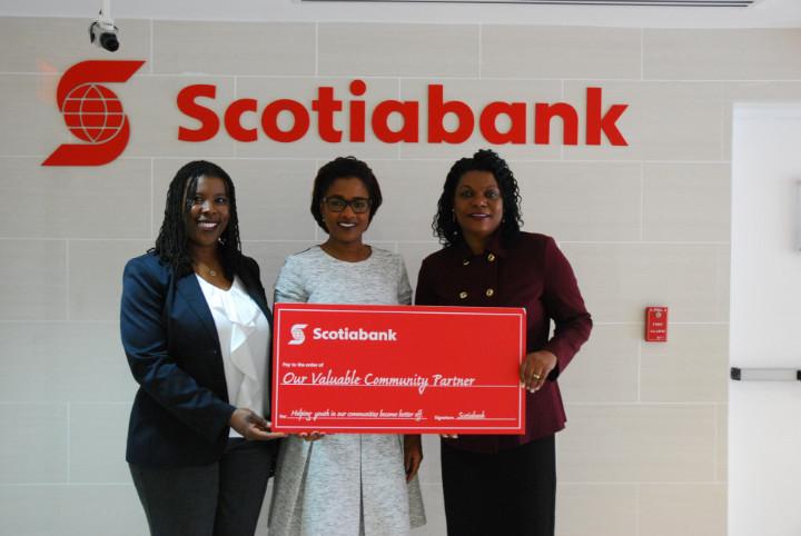 Pictured (l to r): Maxine Seymour, Manager, Public & Corporate Affairs, Sponsorships & Philanthropy; and Nakera Symonette, Senior Manager, Marketing & Public Relations, Scotiabank Caribbean North present the sponsorship cheque to Janet Serrette, Branch Manager, Sunshine Insurance, Blue Hill Road Office